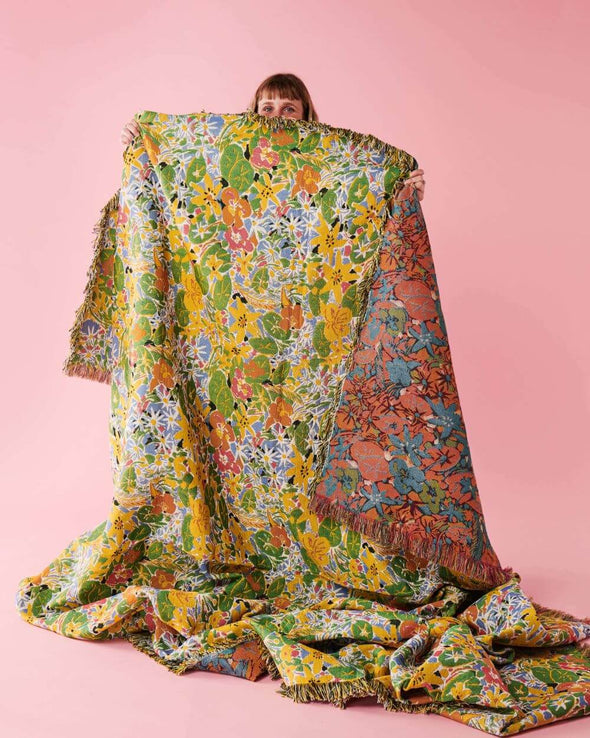 Ken Done Nasturium Tapestry Blanket being held up