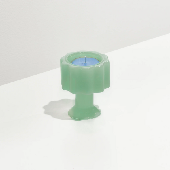 Blue tealight in the Fazeek Wave candle holder