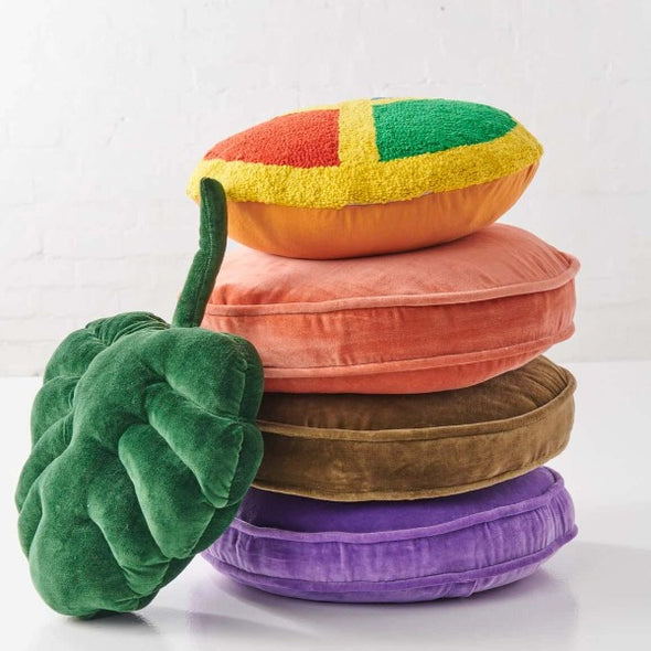 Stack of velvet pea cushions