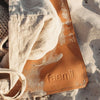 faemli debossed logo close up